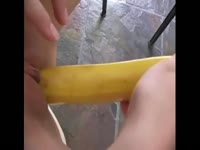 Teen uses banana as a dildo